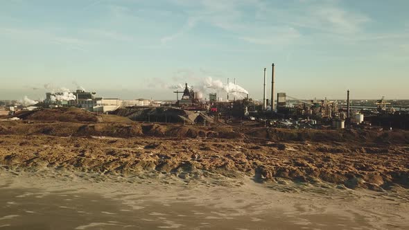 Aerial view of factory Tata Steel with smoking chimneys in Holland