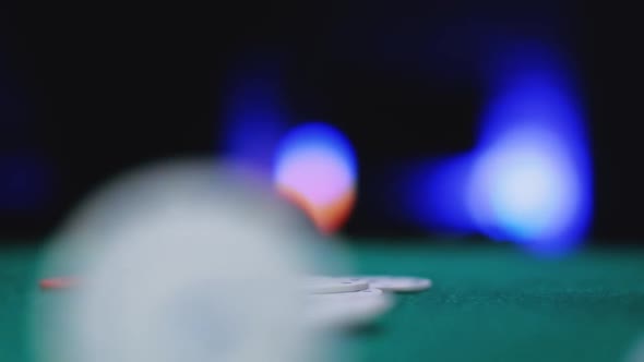 Casino Poker Chips Are Falling on Green Felt Background