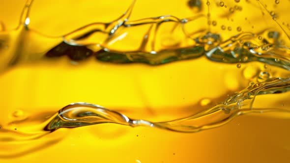 Super Slow Motion Shot of Pouring Golden Oil Liquid at 1000Fps