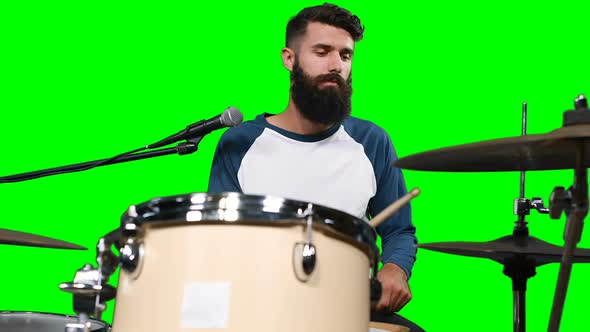 Male drumer playing drum