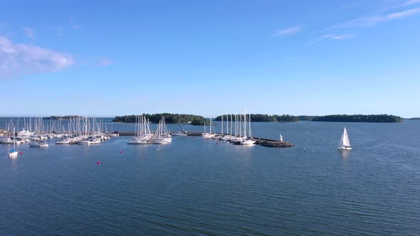 A Sailing White Boat in the Waters of Baltic Sea in Helsinki Finland