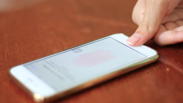 Girl Unlocking The Smartphone With Fingerprint