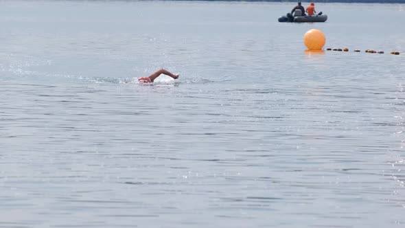 A group of athletes swims to the finish line. The desire to win.