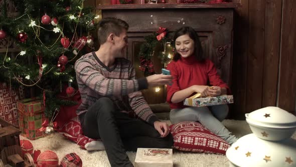 Family Couple Packing the Presents at Home