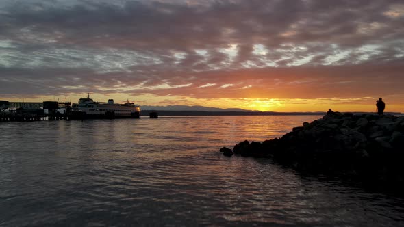 Aerial shot of breathtaking sunset behind the Edmonds ferry in Washington state.