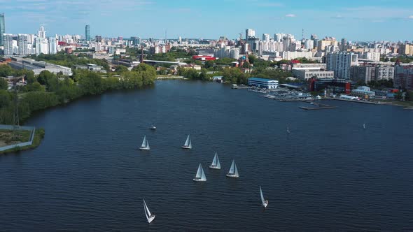 City pier with many sailing yachts 