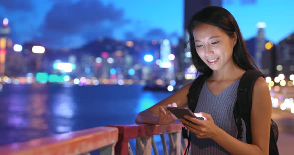 Woman using mobile phone in Hong Kong 