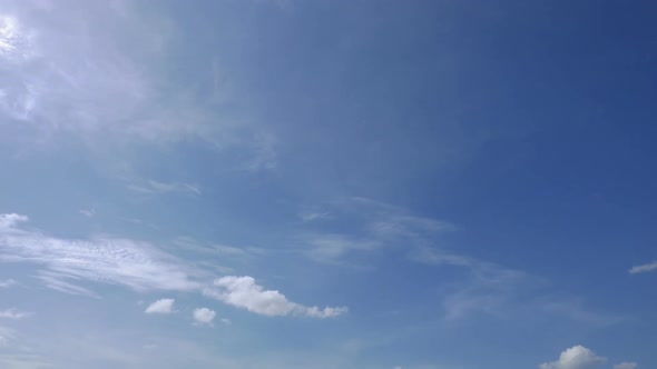 Time lapse of white cloud moving pass around sky background