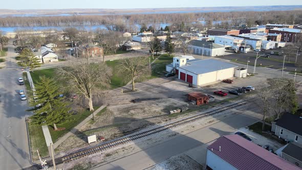 Aerial lining up with a railroad track in a a small town, Chillicothe, Illinois