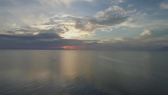 Aerial view of boat driving far away during the sunset, Kep, Cambodia.