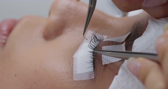 Beautiful young woman with eyelash extension