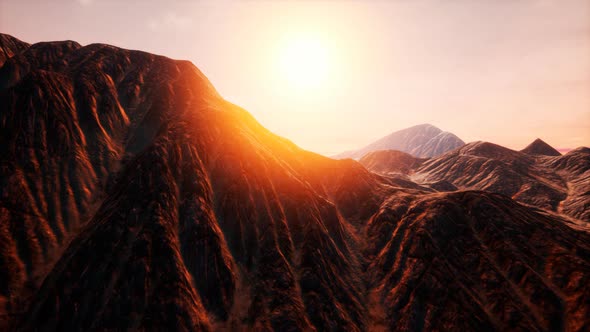 Sun Rays Over Mountains in a Valley