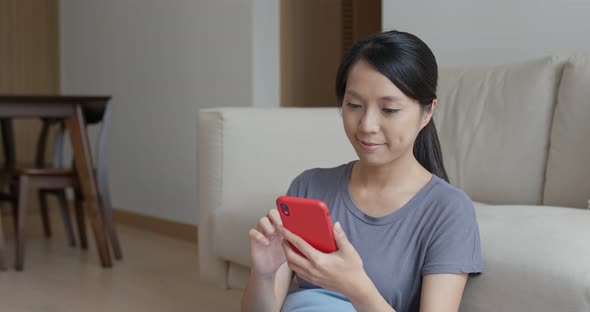 Woman use of mobile phone at home