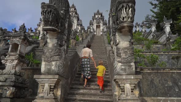 Slowmotion Shot of a Tourists Father and Son Visiting the Pura Lempuyang Temple at the Bali Island