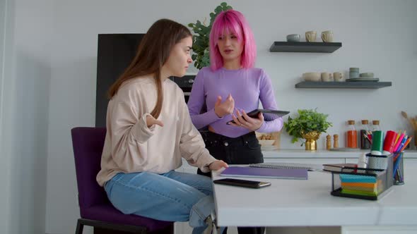 Positive Female Students with Tablet Pc Working on University Report Indoor