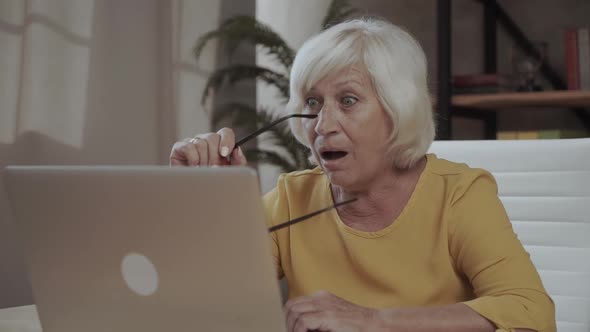 Surprised Senior Woman and Laptop. Old Lady with Open Mouth. New Technologies Are Amazing.