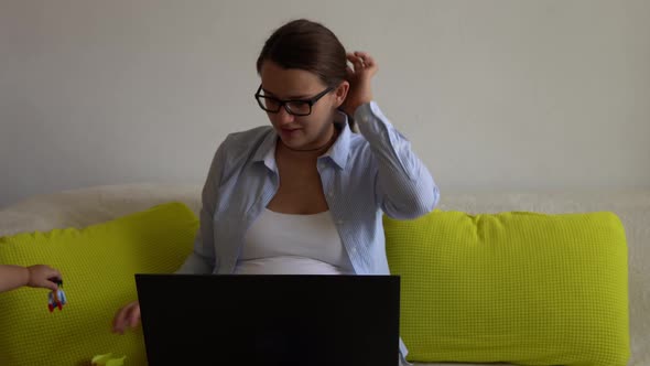 Successful Hardworking Pregnant Business Woman With Laptop and Noutbook