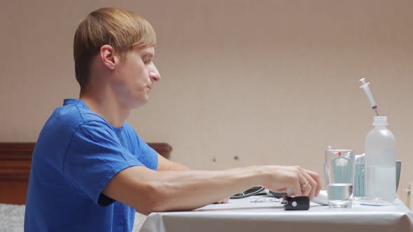 Man Measures Temperature And Drinks The Pill