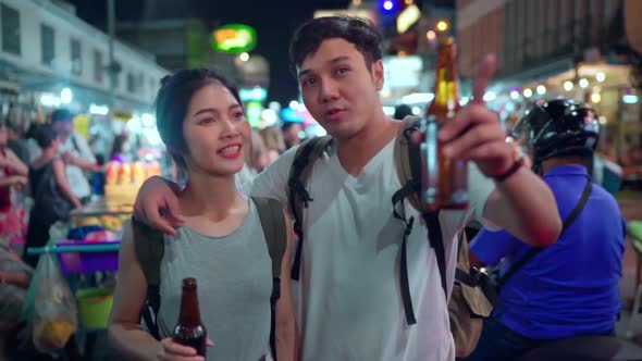 Couple drinking alcohol or beer while hangout at The Khao San Road.