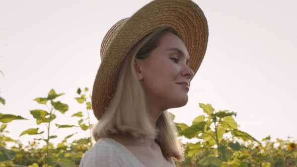 Beautiful Girl In Sunflower Field