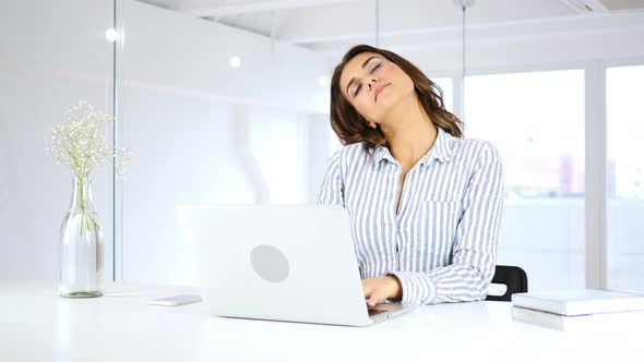 Tired Hispanic Woman at Work Relaxing, Neck Pain