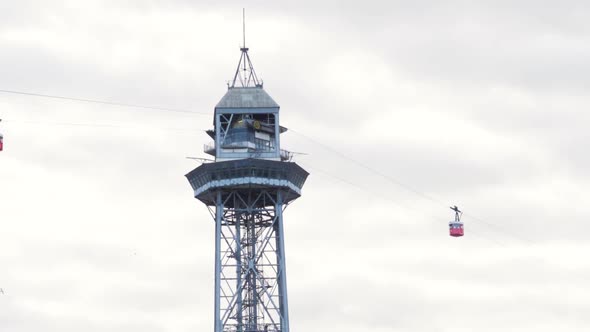 Barcelona Port Vell Cable Car Cabins Leaving Torre Jaume I in Barcelona Spain