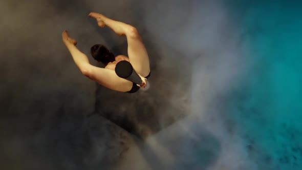 Girl Dancing on a Pole. Blue Smoke Background. Slow Motion. Top View