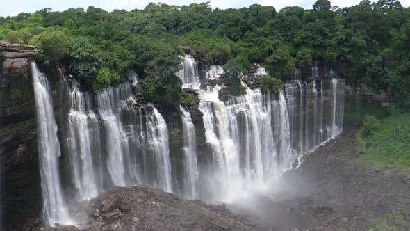 Streams of water falling down at the Kalandula Falls