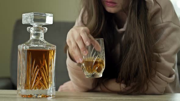 Woman is Drinking Whiskey Alone