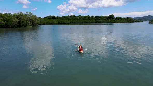 Couple in Kayak in the Ocean of Phuket Thailand Men and Woman in Kayak at a Tropical Island with