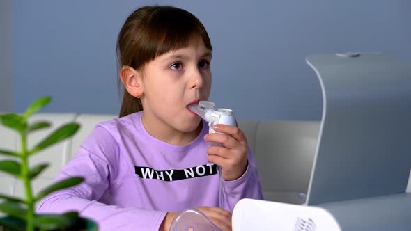 Little Girl Turn on Nebulizer to Make Inhalation with Medical Inhaler at Home