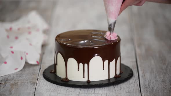 The Pastry Chef Prepares and Decorates the Cake at Home