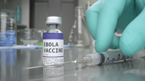 Ebola vaccine with syringe placed next to it