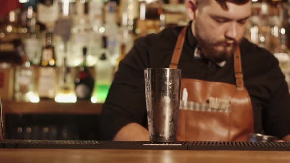 Barman with Moustache Making Cocktail