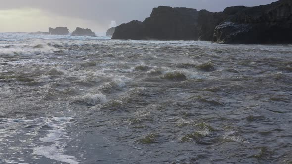 Flowing Seawater And Rocky Coastline