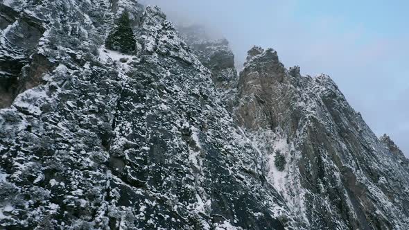 Aerial view of jagged mountains covered in snow