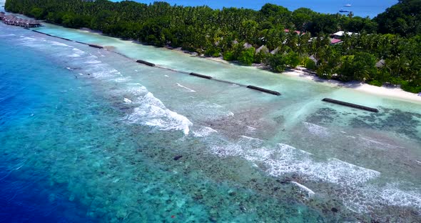 Beautiful birds eye copy space shot of a sunshine white sandy paradise beach and aqua turquoise wate