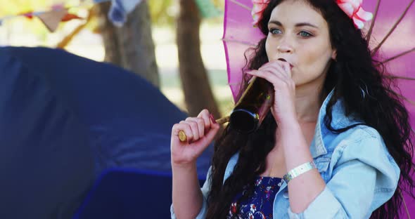 Woman drinking beer at music festival 4k