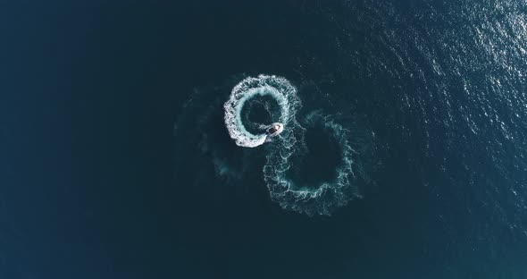 Aerial Top View of a White Pleasure Boat on a Summer Day