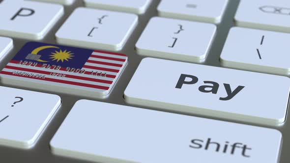 Bank Card Featuring Flag of Malaysia As a Key on Keyboard alt