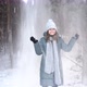 Woman Staing Snowy Forest and Throwing Handful of Snow - VideoHive Item for Sale