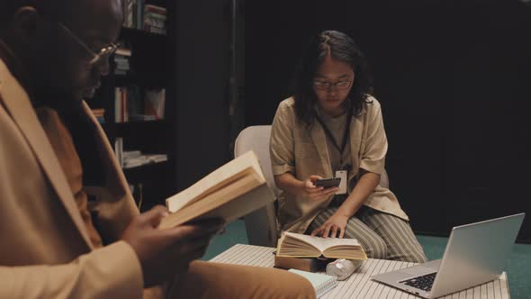 People Reading and Studying at Library