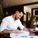 Slow Motion Candid Image of a Pensive Businessman in a Cafe - VideoHive Item for Sale
