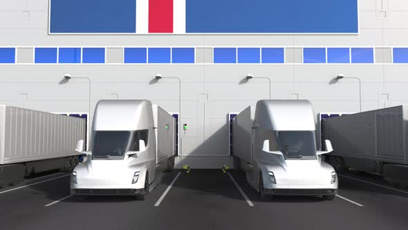 Trucks at Warehouse Loading Bay with Flag of ICELAND alt
