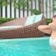 Young asian woman enjoy around outdoor swimming pool for leisure - VideoHive Item for Sale