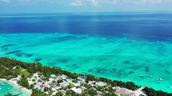 Aerial nature of marine lagoon beach wildlife by clear ocean and white sandy background of a dayout 