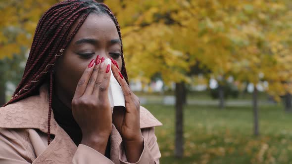 Unhealthy Young African Lady Using Paper Tissue Wiping Runny Nose