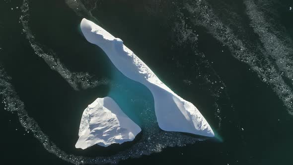 Top Down View Antarctic Iceberg. Aerial Flight.