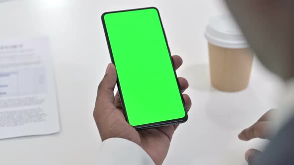 African Man Using Smartphone with Chroma Key Screen