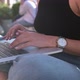 Close Up Woman Sitting in Park Outdoor Typing Working Online on Laptop Freelance Businesswoman - VideoHive Item for Sale